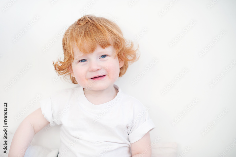Bright redhead boy on a white background Bright redhead boy on a white background