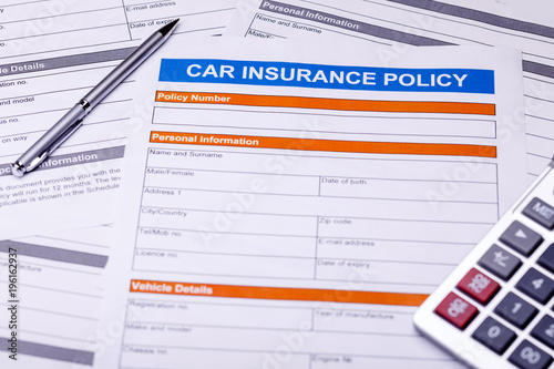 Car insurance policy. Documents, pen and calulator on table. Business and insurance background concept.