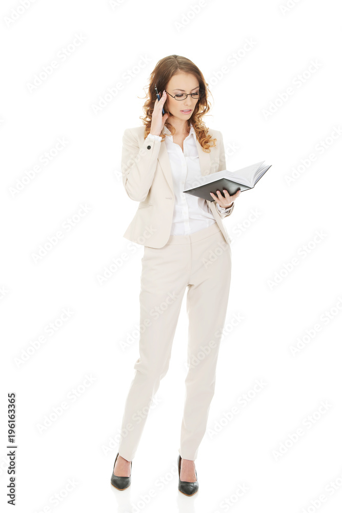 Thoughtful businesswoman with note. Thoughtful businesswoman with note.