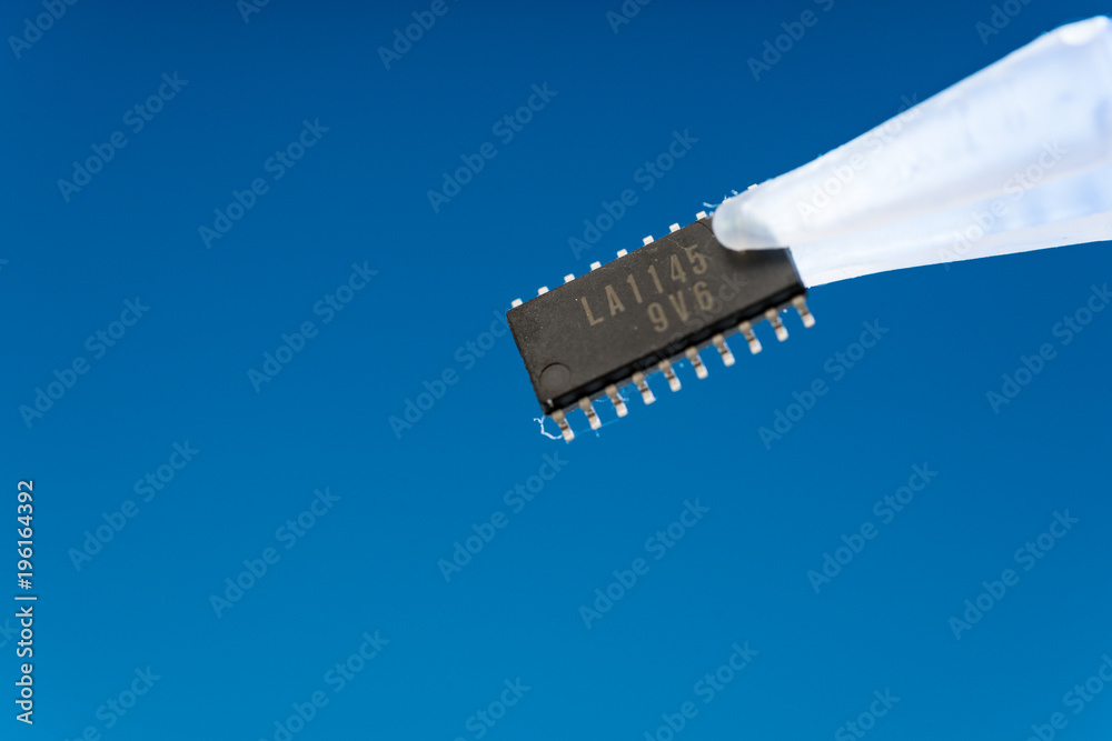 Tweezers and electronics chip Tweezers and electronics chip