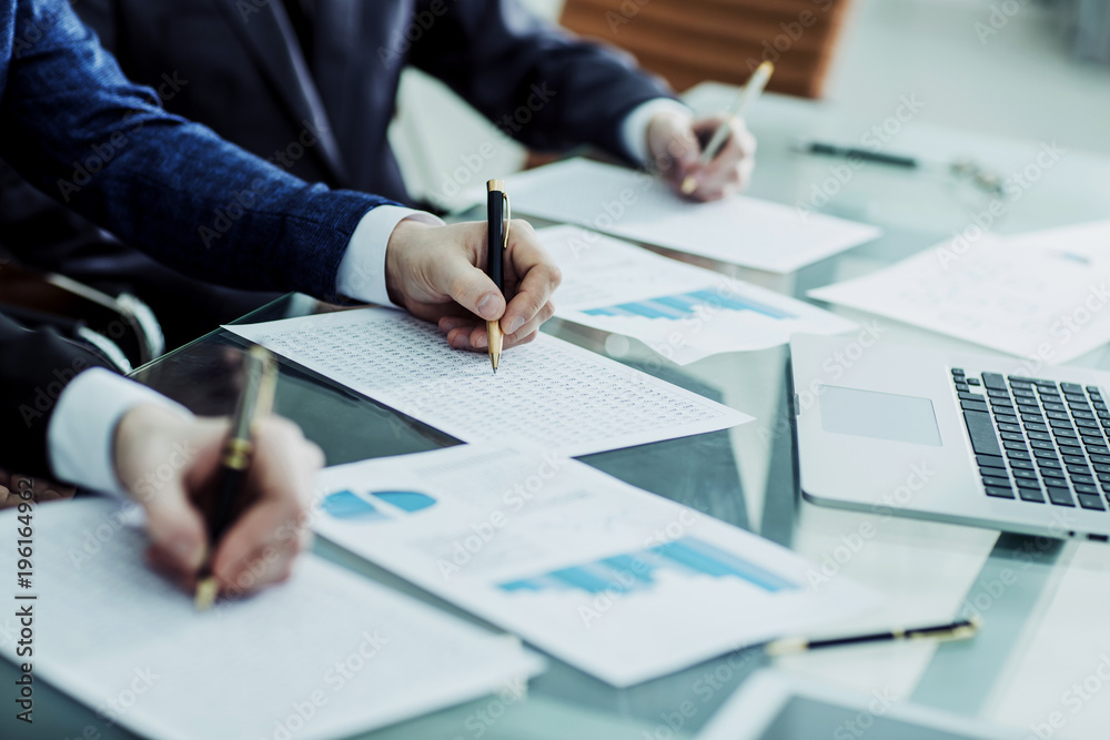 hands business team that works with financial schemes hands business team that works with financial schemes