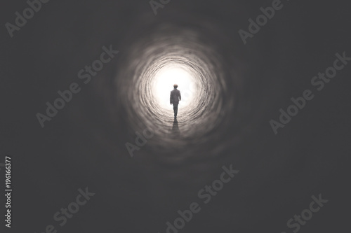 man walking in the dark