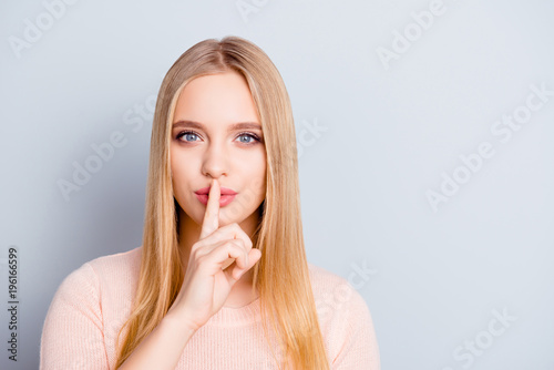 Mute dumb mystery say lips intimate delicate people forefinger speechless voiceless person concept. Close up portrait of charming tempting lovely cute girl making shhh isolated on gray background