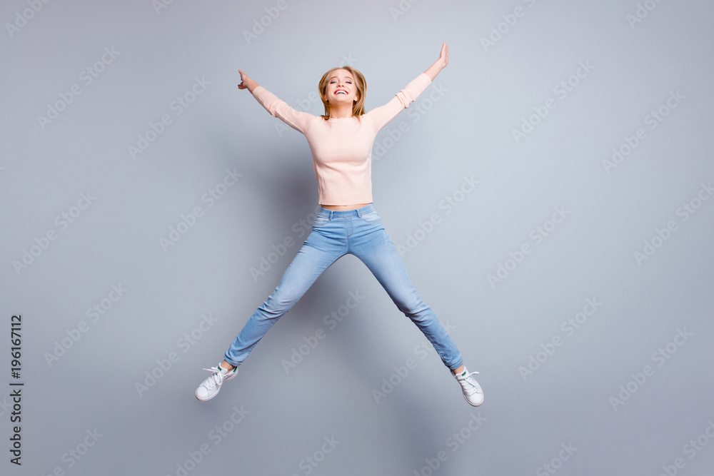 Trendy holiday vacation carefree leisure people pass exams person fall concept. Full-size view of excited careless delightful beautiful charming active teenage girl jumping up isolated gray background