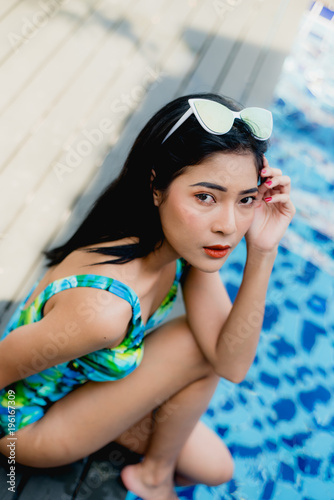 girl wear bikini in swimming pool