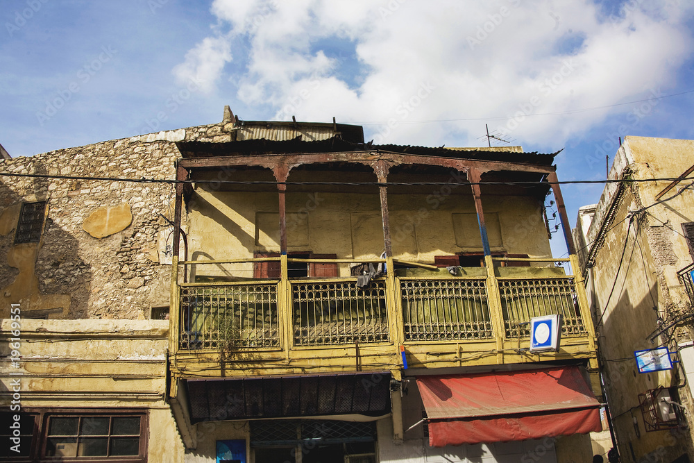 view of an ancient and broken house in the heart of a city of morocco view of an ancient and broken house in the heart of a city of morocco