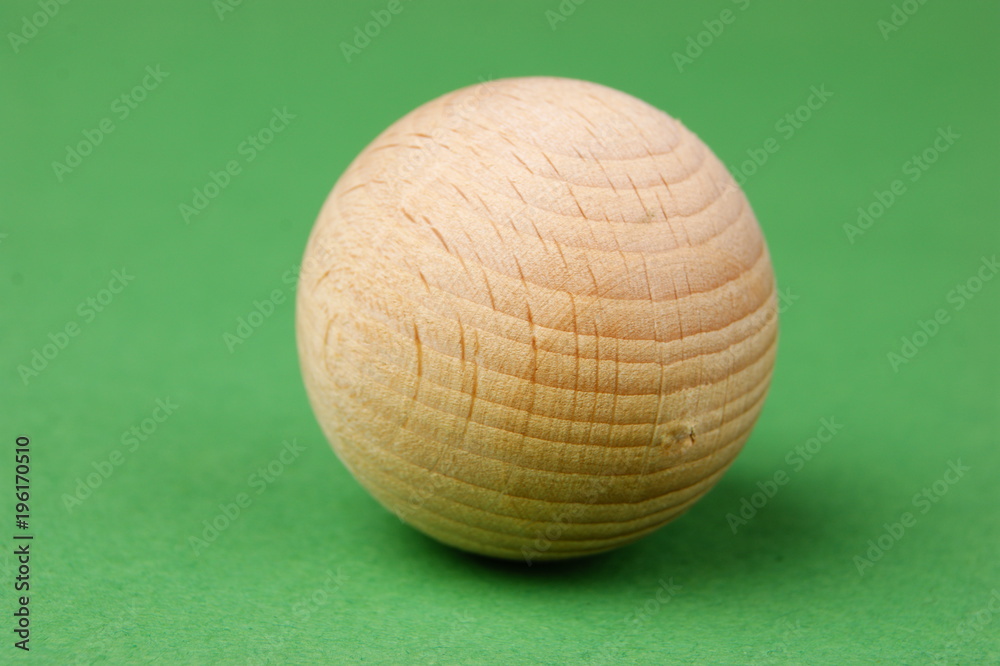 wooden geometric shapes on a green background wooden geometric shapes on a green background