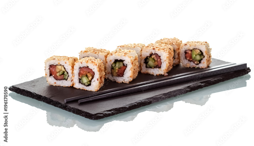 Sushi rolls sprinkled with seeds of sesame and chopsticks, on special stand, isolated on white Sushi rolls sprinkled with seeds of sesame and chopsticks, on special stand, isolated on white