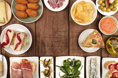 The food of Spain. Overhead photo of many different Spanish tapas with copy space