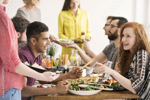 Vegan friends eating healthy salad