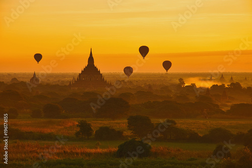 .View of the sunrise over the temples of the plain of Bagan