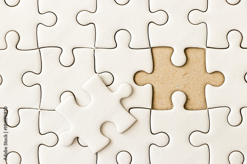 Closed up background of white plain jigsaw wait missing piece to match or fulfill Closed up background of white plain jigsaw wait missing piece to match or fulfill