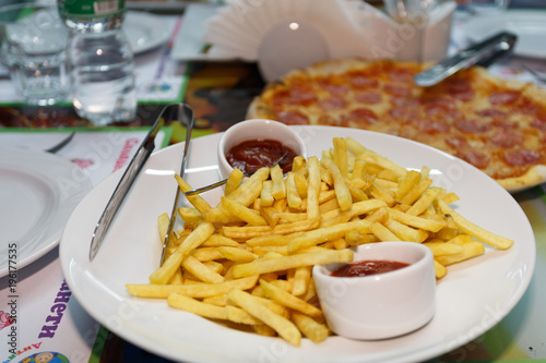 French fries with ketchup on the plate