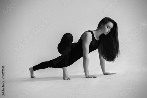  sports girl doing stretching in studio