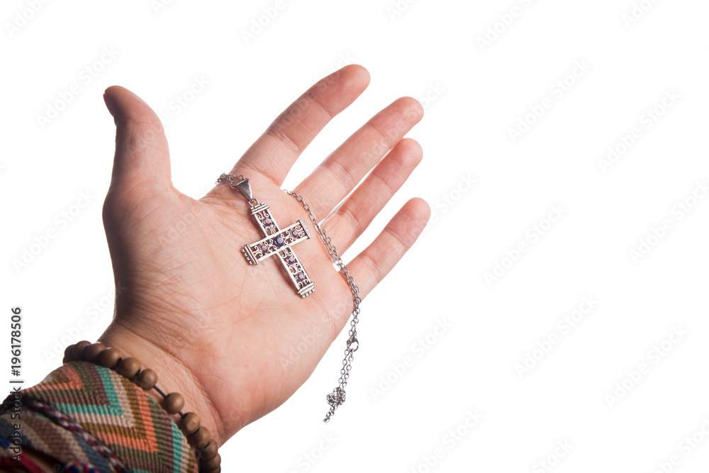 Hand holding Christian cross Hand holding Christian cross