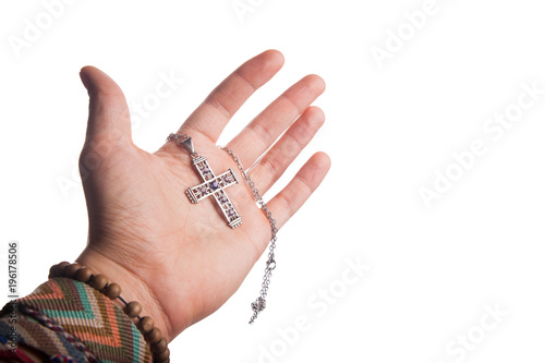 Hand holding Christian cross