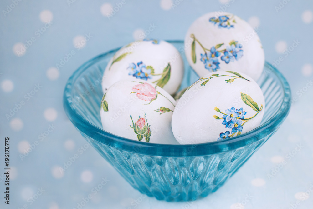 Easter Eggs with floral pattern on the blue polka dot background