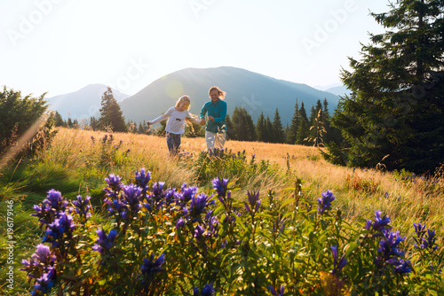 Happy mom and her teenage daughter are running