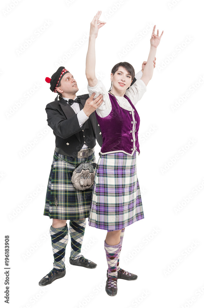 Man in kilt teaching woman Scottish dance