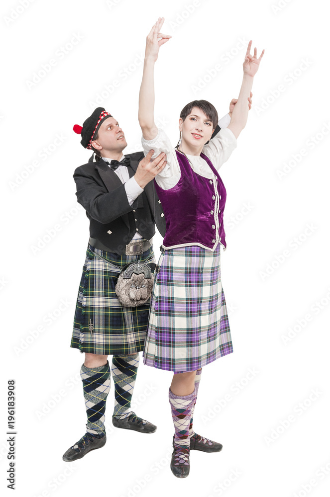 Man in kilt teaching woman Scottish dance Man in kilt teaching woman Scottish dance