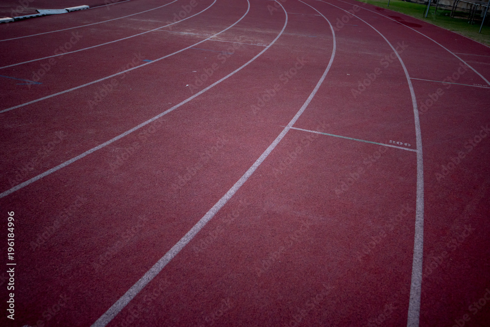 Fototapeta premium Red running track at night
