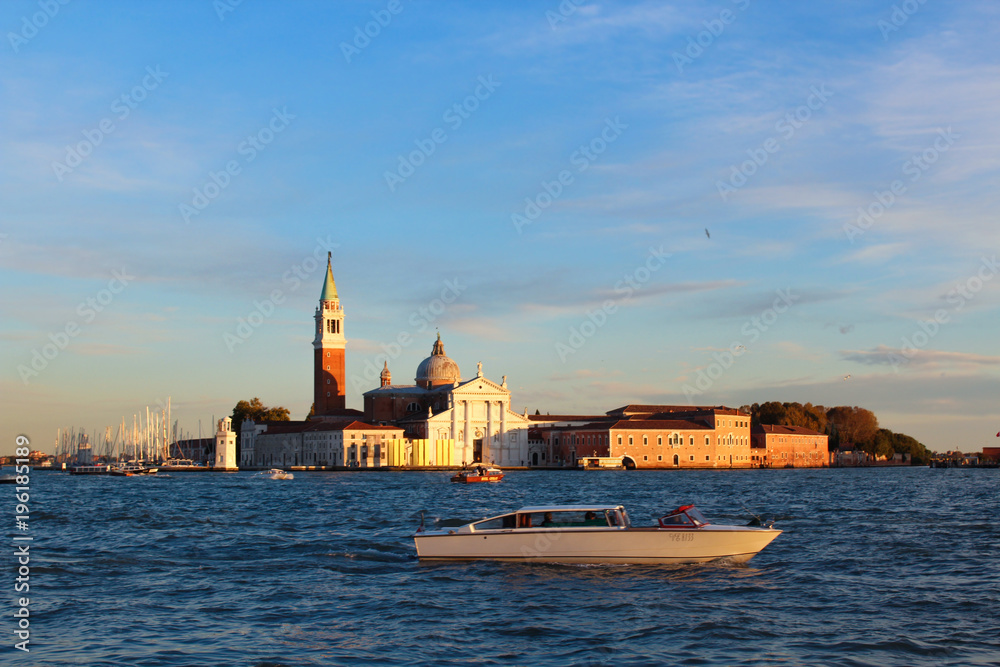 Venetia at sunset floating boat on water Venetia at sunset floating boat on water
