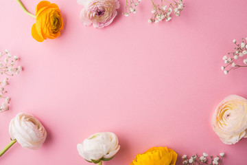Easter and spring flat lay on a pink background.