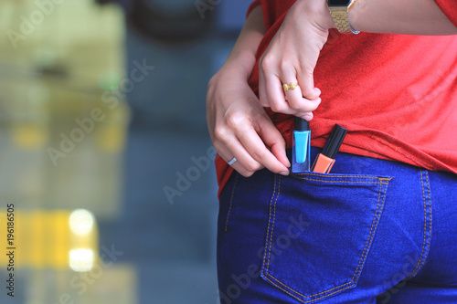 woman trying to steal items in a department store   Pathological stealing  Kleptomania 