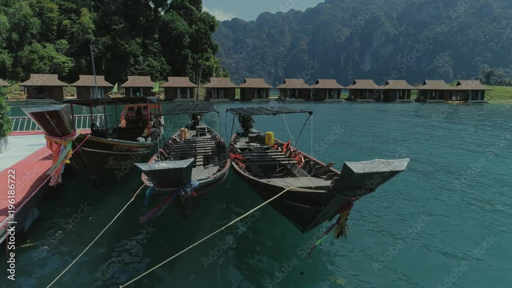 Tropical Thai jungle lake Cheo lan drone flight, wild mountains nature national park ship yacht, fishing boats Tropical Thai jungle lake Cheo lan drone flight, wild mountains nature national park ship yacht, fishing boats