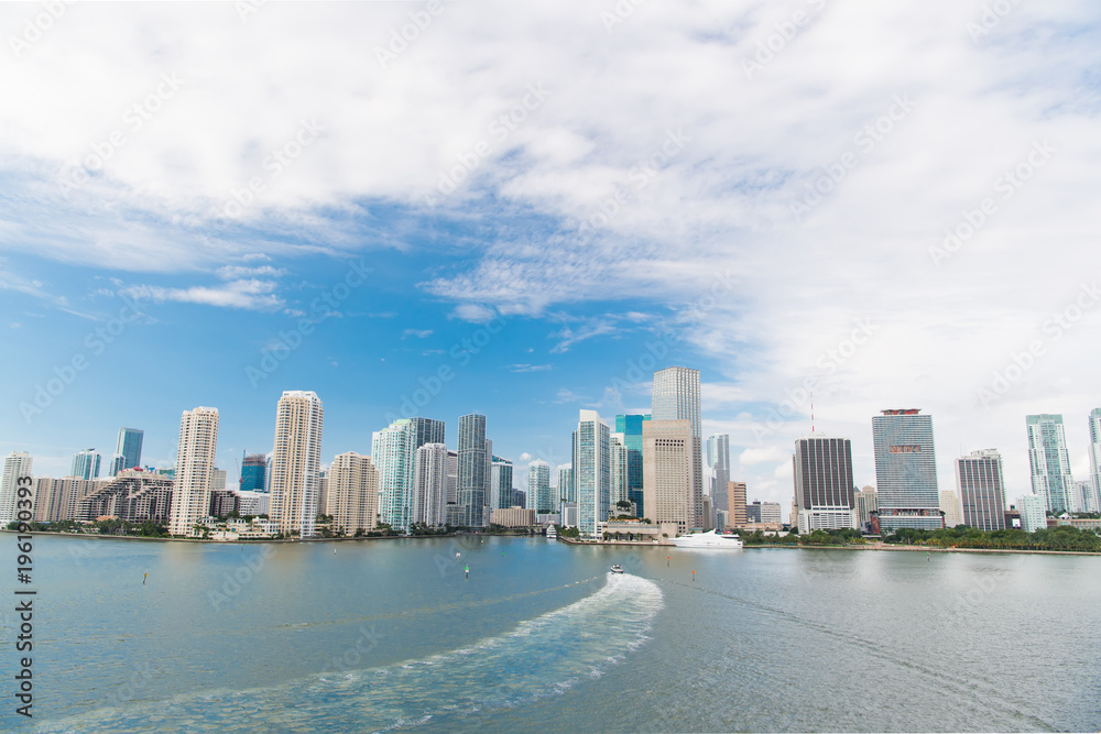 Aerial view of Miami skyscrapers with blue cloudy sky Aerial view of Miami skyscrapers with blue cloudy sky