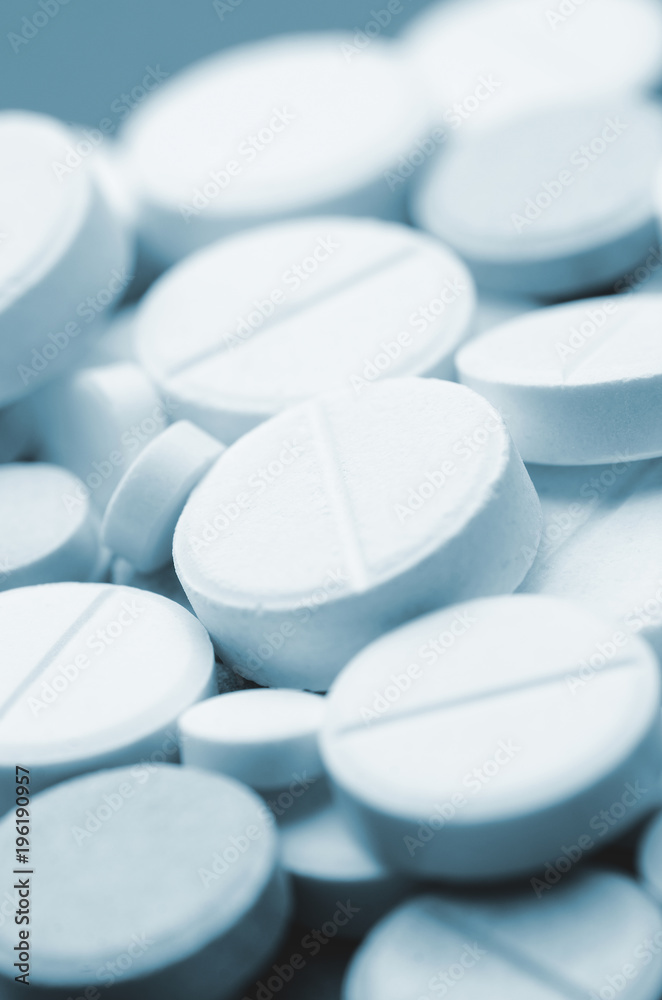 Round tablets close-up. Soft focus, vertically Round tablets close-up. Soft focus, vertically
