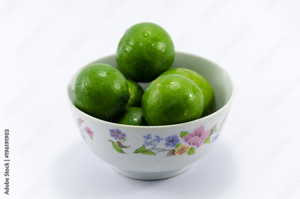 Lemons on cup isolated with white background Lemons on cup isolated with white background