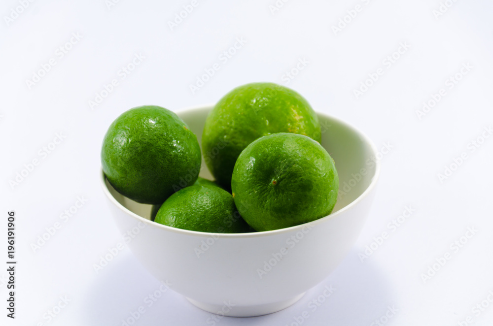 Lemons on cup isolated with white background Lemons on cup isolated with white background