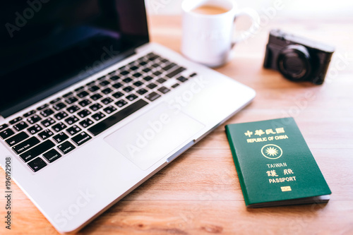 Taiwan passport, Computer and camera on wood table