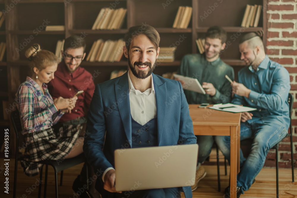 employee of the company with laptop on the background of busines employee of the company with laptop on the background of busines