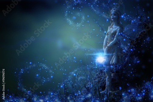 image of magical little fairy in the night forest.