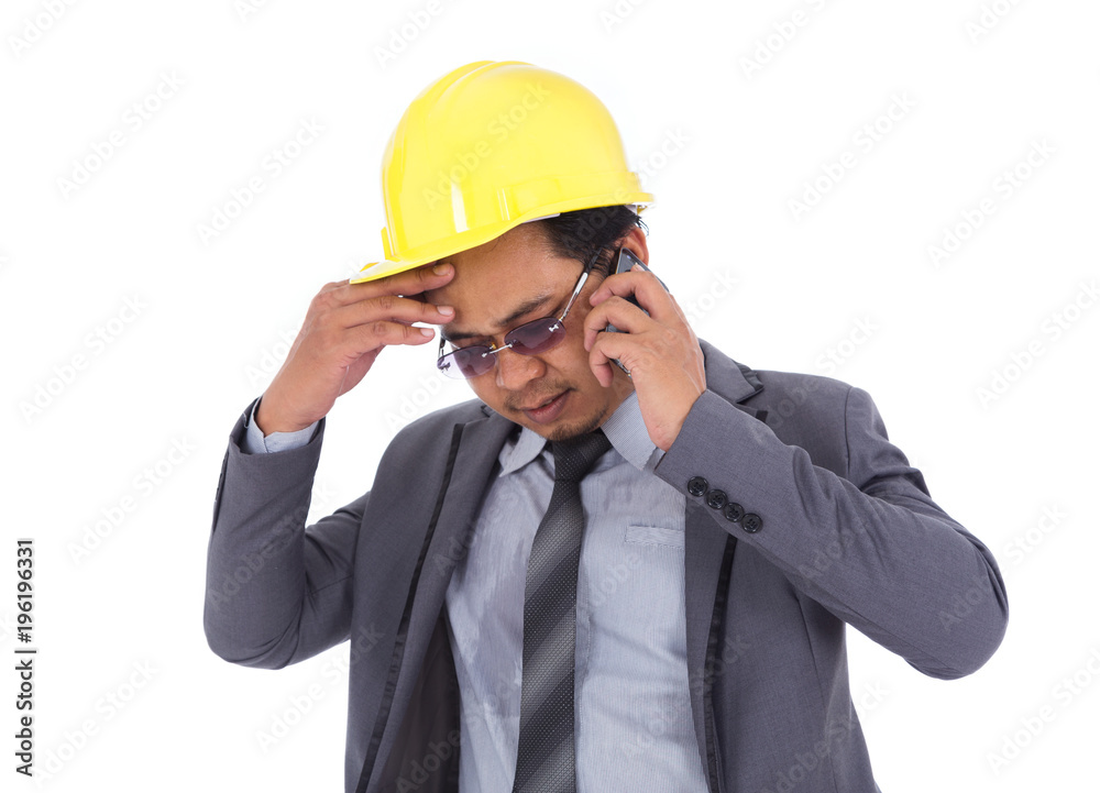 engineer receiving bad news on the cell phone isolated on white background engineer receiving bad news on the cell phone isolated on white background