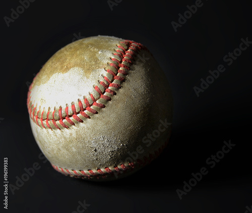 Old vintage baseball on black background