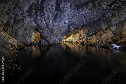 Underground river and cave with outdoor openings show in long exposure