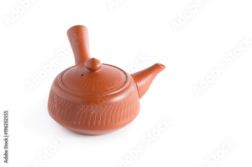 Japanese tea set. Ceramic teapot and a steaming cup Isolated on white background