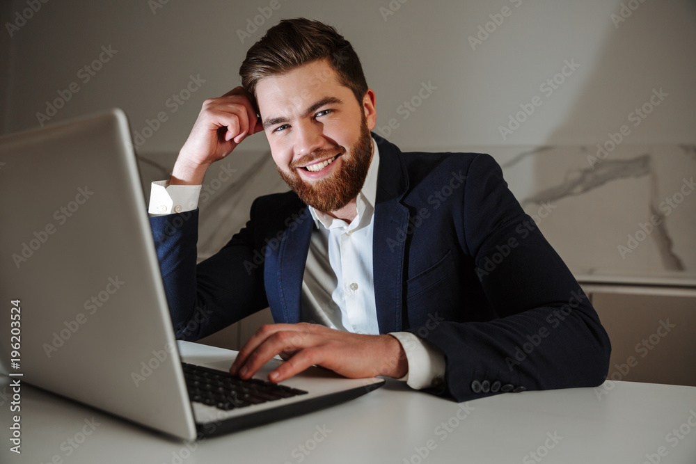 Portrait of a smiling young businessman dressed in suit Portrait of a smiling young businessman dressed in suit