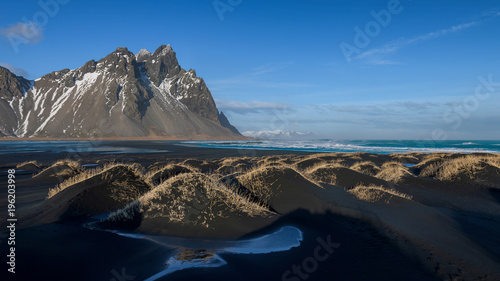 Vestrahorn Mountain and black sand mound dunes  in southern Iceland