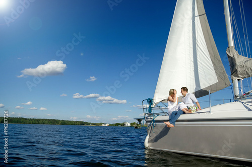 loving couple on a yacht at sea. © velimir