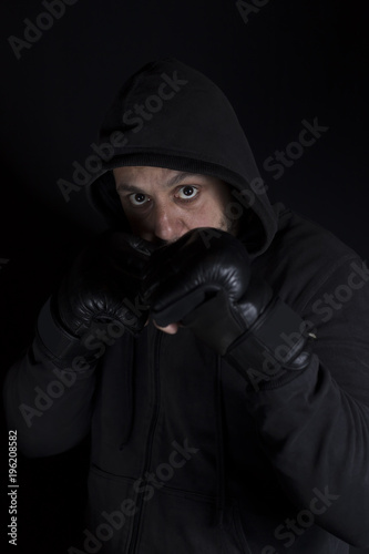 Portrait of a boxer in fight position. Soft focus