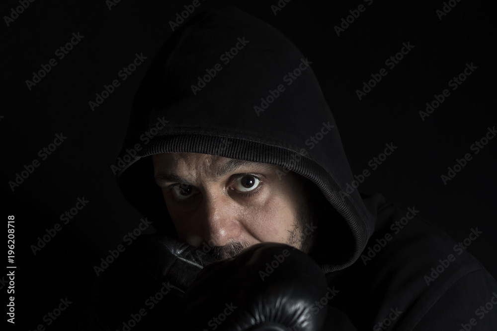 Portrait of a boxer in fight position. Soft focus Portrait of a boxer in fight position. Soft focus