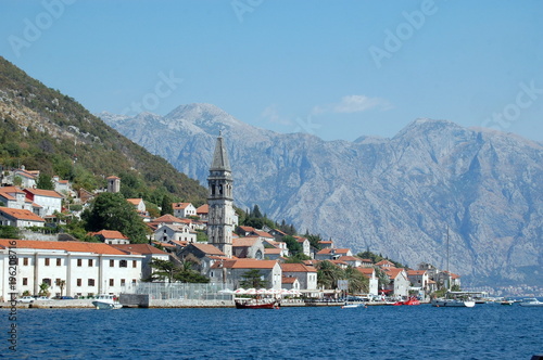 City Perast on a mountainside in the Bay of Kotor on the background of Kotor.