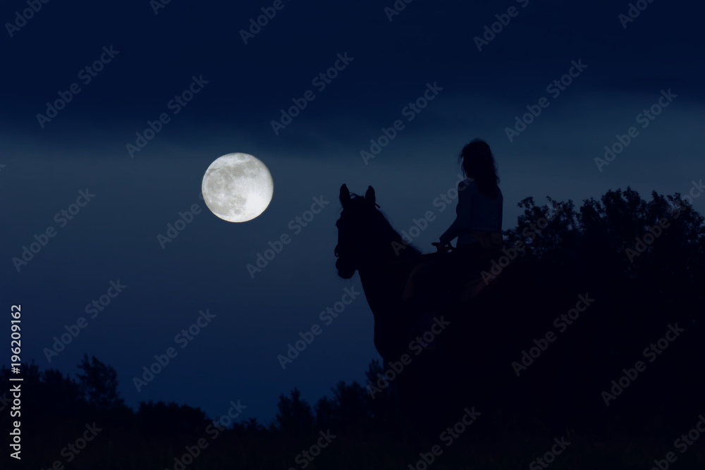 Couple: girl rider and horse are looking at the big full moon at night and dreaming. Fantasy moonlight in mountains. Sleepwalking, somnambulism concept. Couple: girl rider and horse are looking at the big full moon at night and dreaming. Fantasy moonlight in mountains. Sleepwalking, somnambulism concept.