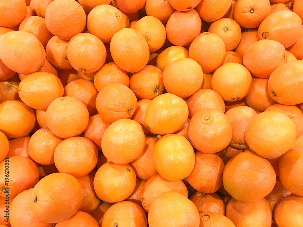 heap of fresh mandarin oranges texture background