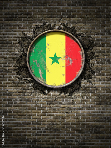 Old Senegal flag in brick wall photo