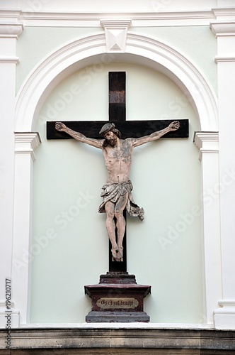 old jesus statue and cross